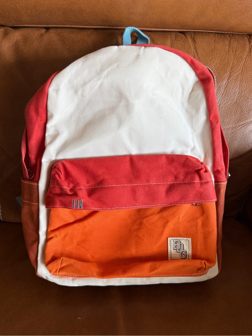 Canvas Colorblock Backpack in Off White, Rust, Orange